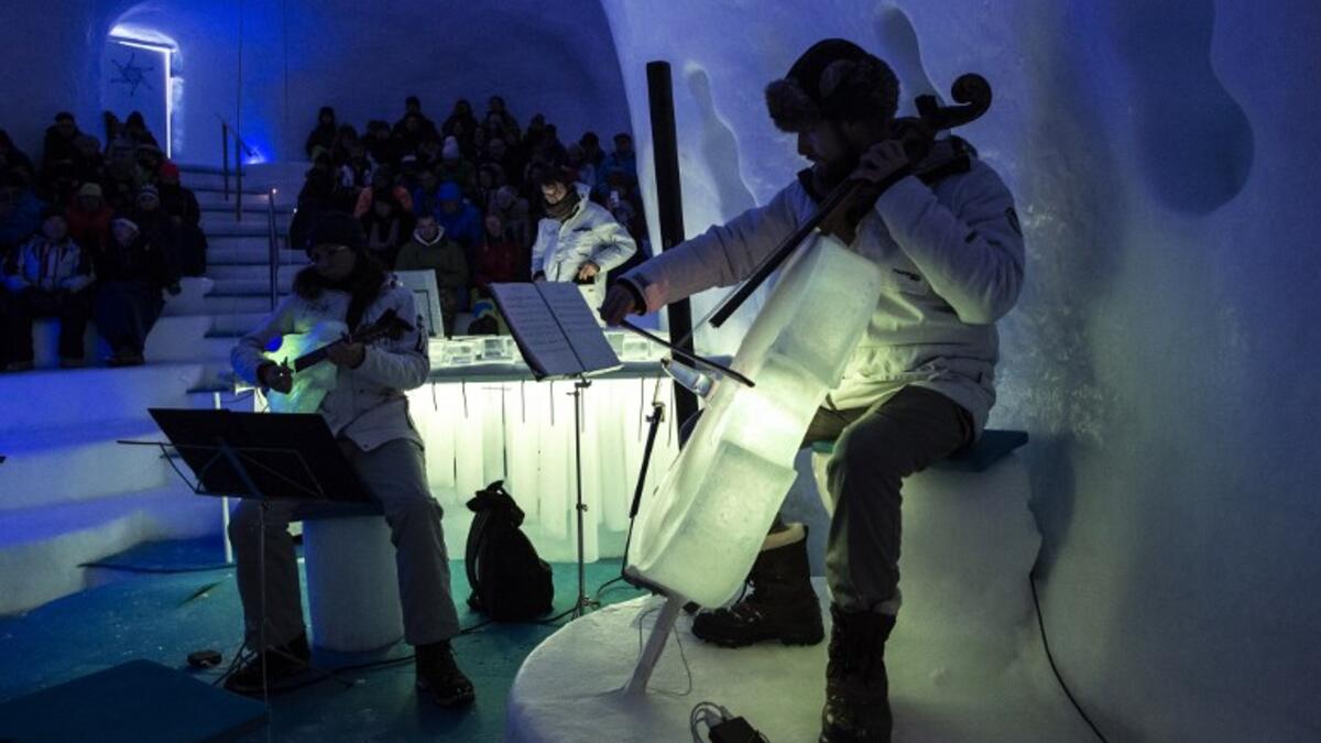 Musicians perform with ice instruments during a concert in the "Ice Dome" on Presena Galcier, Tonale Pass, near Trento in northern Italy on January 17, 2018.
MARCO BERTORELLO / AFP