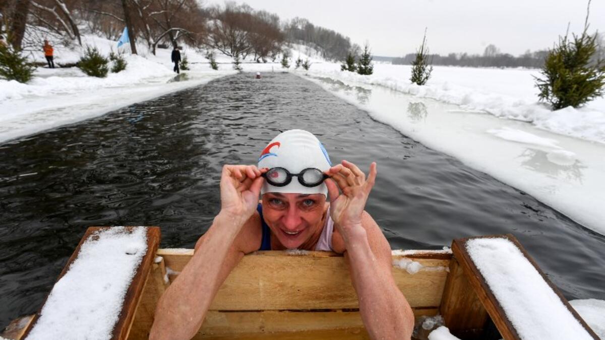 Natalya Seraya, the founder and chief of Moscow's ice swimming club "Walruses of the Capital", poses while swimming in the icy waters of the Moscow River on February 3, 2019. 
Kirill KUDRYAVTSEV / AFP