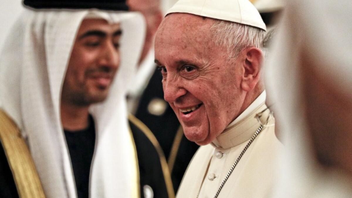 Pope Francis smiles upon his arrival at Abu Dhabi International Airport in the UAE capital on February 3, 2019. 
Andrew Medichini / POOL / AFP