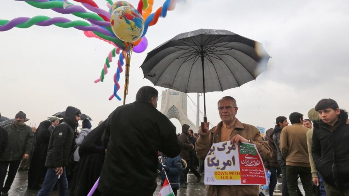 Iranians assemble in the capital Tehran's Azadi (Freedom) square on February 11, 2019 during a ceremony celebrating the 40th anniversary of Islamic Revolution. 
ATTA KENARE / AFP