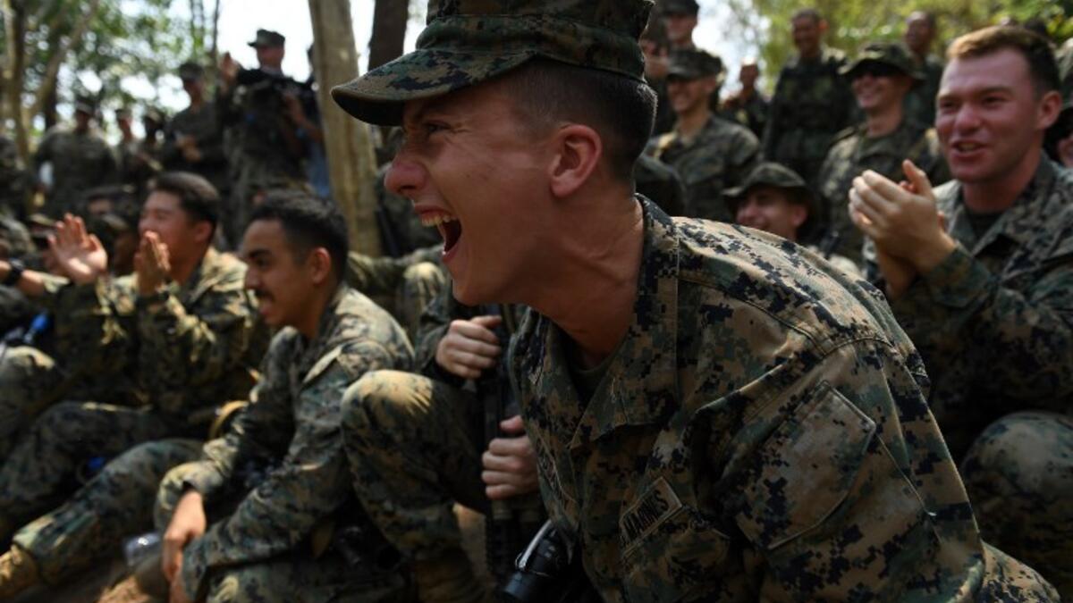 US Marine react during a jungle survival training with Thai soldiers in the joint 'Cobra Gold' military exercise in Chantaburi province 
Lillian SUWANRUMPHA / AFP