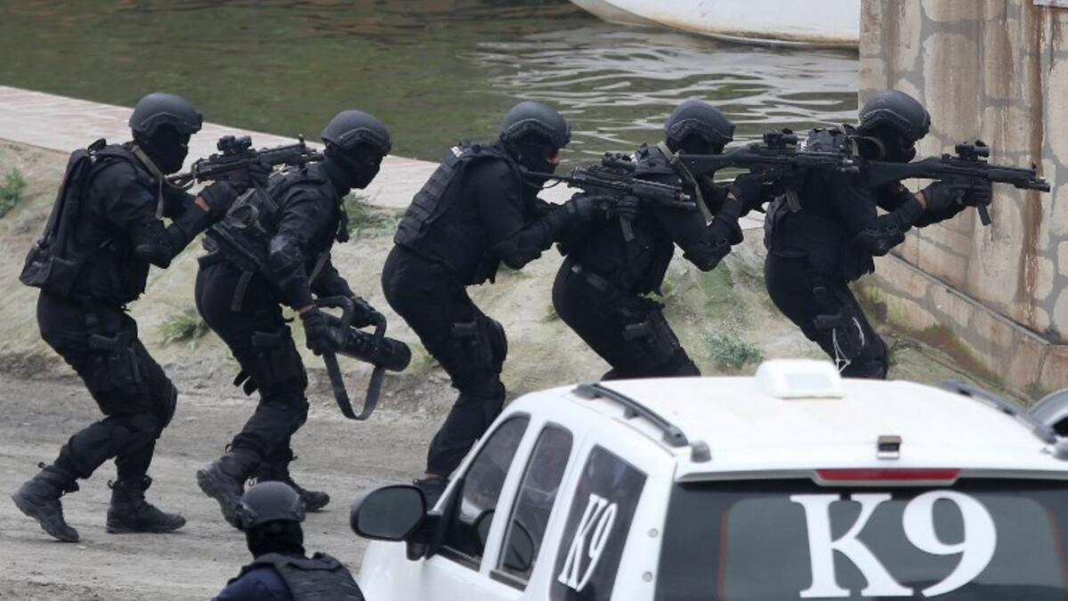 Members fo the UAE Armed forces perform a military drill during the opening of the International Defence Exhibtion and Confrence at the Abu Dhabi National Exhibtion Centre on February 17, 2019. 
AFP