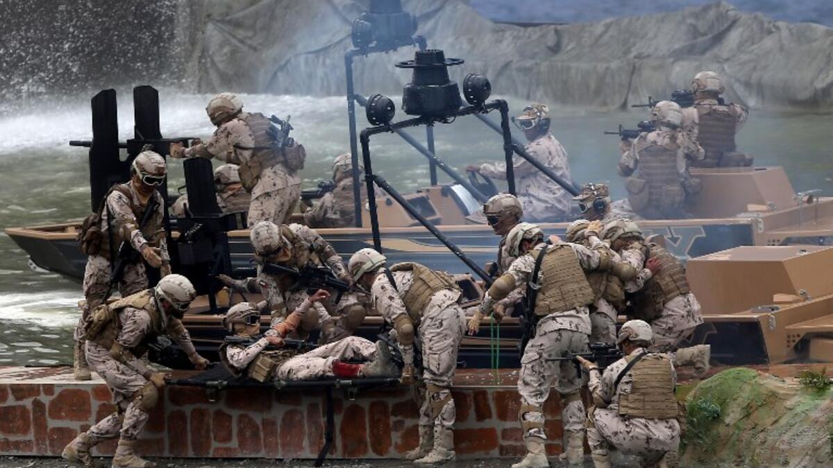 Members fo the UAE Armed forces perform a military drill during the opening of the International Defence Exhibtion and Confrence at the Abu Dhabi National Exhibtion Centre on February 17, 2019. 
AFP