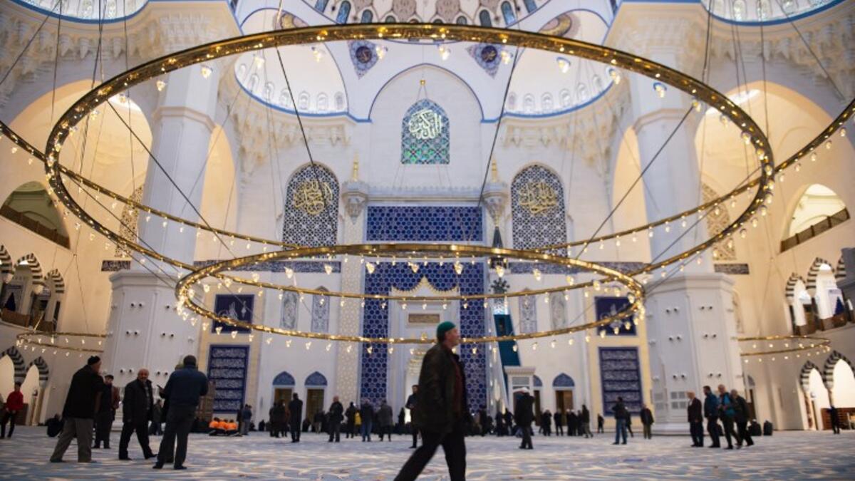 Muslims worshippers arrive for morning prayers at the Camlica Mosque in Istanbul, which opened on March 7, 2019. 
Yasin AKGUL / AFP