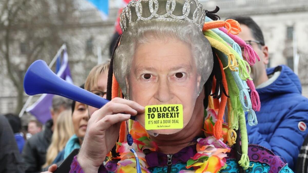 A protester wears a mask of the Queen at a rally organised by the pro-European People's Vote campaign for a second EU referendum in Parliament Square, central London on March 23, 2019.
Isabel INFANTES / AFP