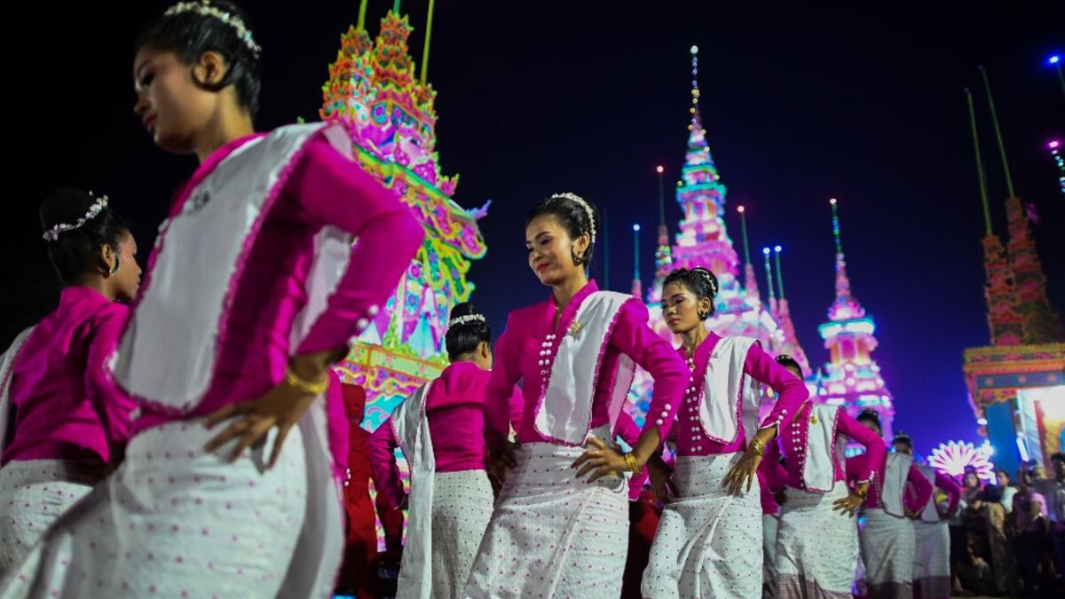 Traditional dancers perform during abbot Kay Lar Tha's funeral procession in Mudon, Mon State. 
Ye Aung THU / AFP