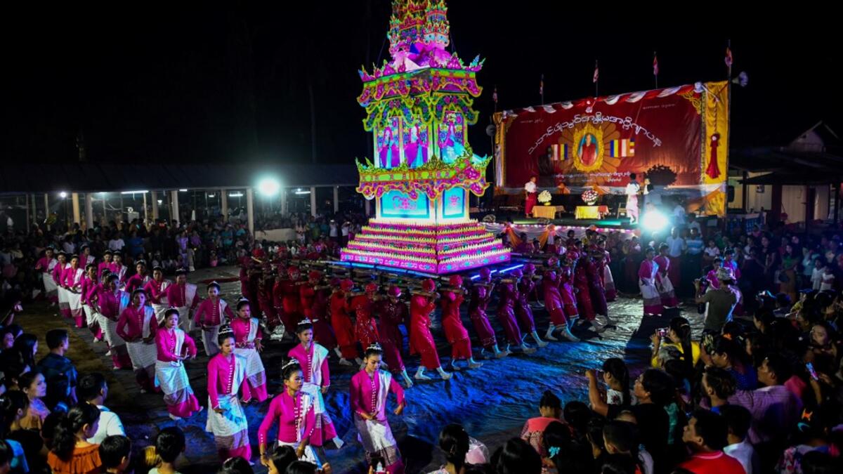 Traditional dancers perform during abbot Kay Lar Tha's funeral procession in Mudon, Mon State. 
Ye Aung THU / AFP