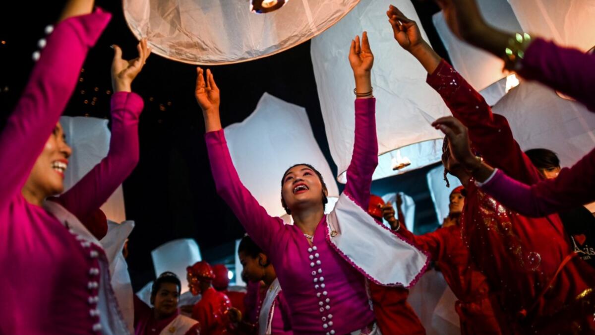 In this picture devotees release lanterns near a makeshift palace during abbot Kay Lar Tha's funeral in Mudon, Mon State. 
Ye Aung THU / AFP