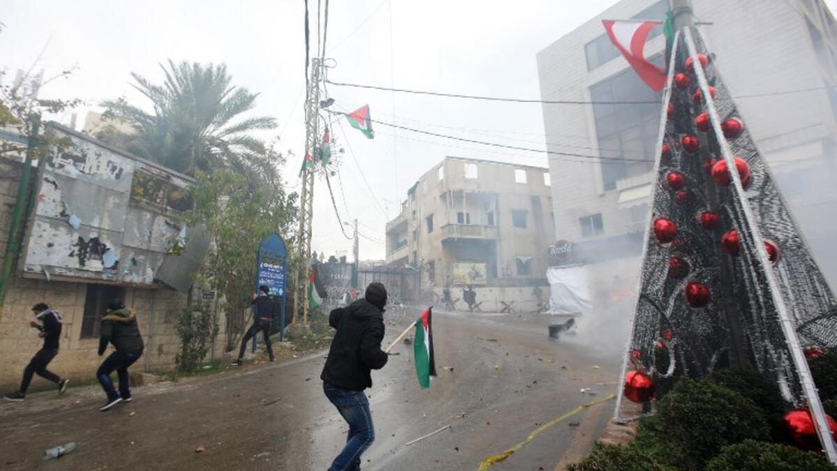 Lebanese security forces fire tear gas to disperse protestors during a demonstration outside the US embassy in Awkar, on the outskirts of the Lebanese capital Beirut, on Dec. 10, 2017, to protest against Washington's decision to recognize Jerusalem as the capital of Israel. 
(ANWAR AMRO / AFP)