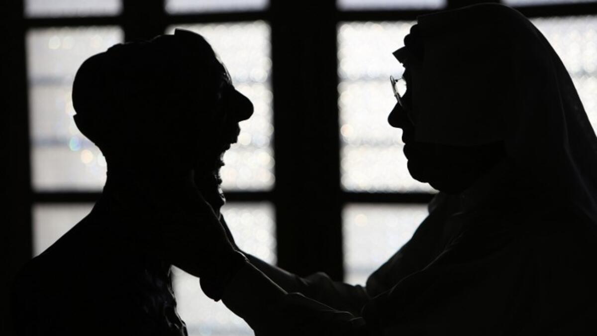 Kuwaiti sculptor Sami Mohammed poses with one of his works at the Museum of Modern Art in Kuwait City on October 4, 2018. 
Yasser Al-Zayyat / AFP