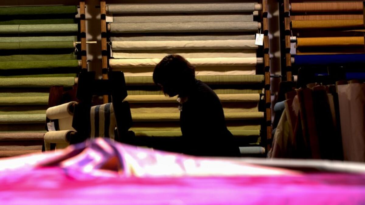 This picture  shows a woman at work in the laboratory of Antico setificio Fiorentino ancient silk factory in Florence. 
Tiziana FABI / AFP