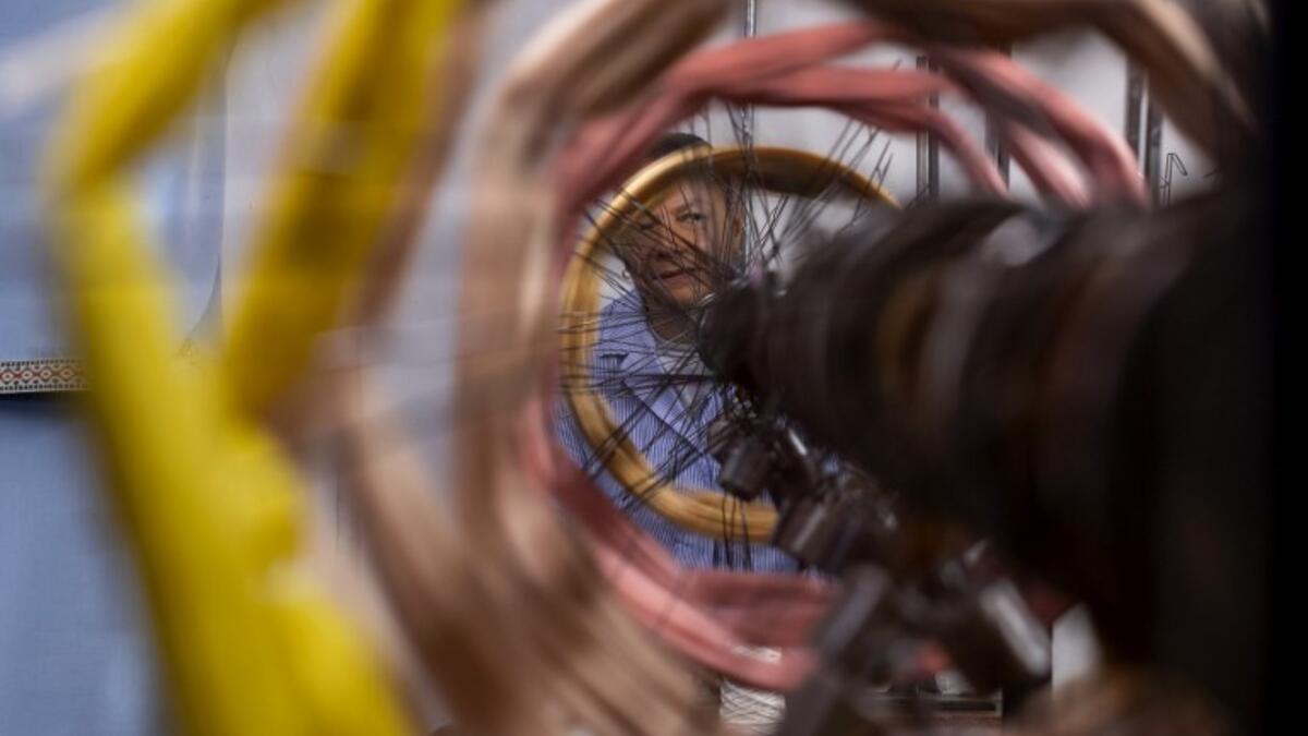 This picture  shows a woman at work in the laboratory of Antico setificio Fiorentino ancient silk factory in Florence. 
Tiziana FABI / AFP