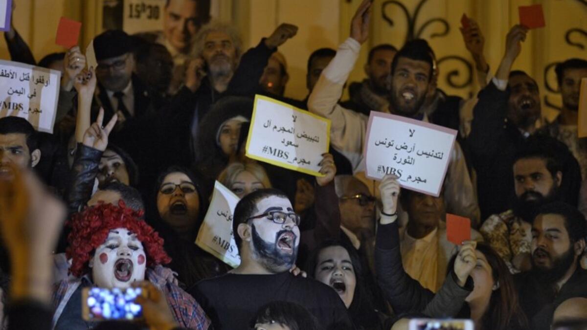 Tunisians demonstrate against the upcoming visit of Saudi Crown Prince Mohammed bin Salman to Tunisia, in November 26, 2018 in the capital Tunis. The sign in Arabic reads "No to the desecration of Tunisia, country of the revolution". 
AFP