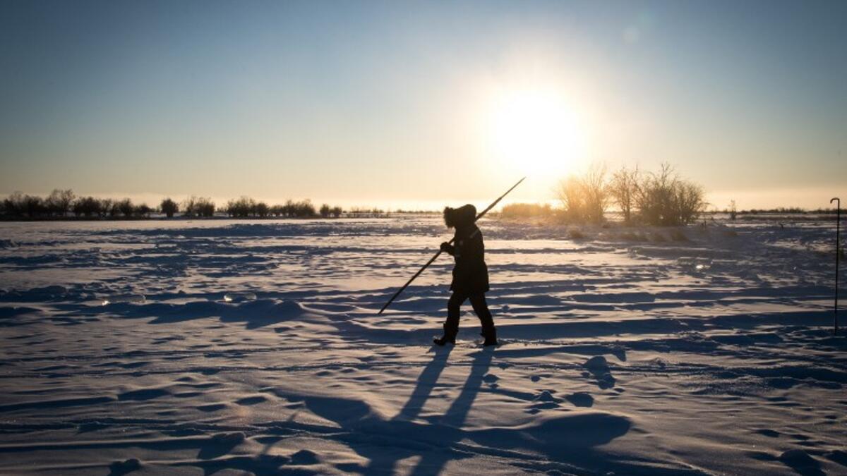 Villagers harvest ice from a local lake near the settlement of Oy, some 70 km south of Yakutsk, with the air temperature at about minus 41 degrees Celsius.
Mladen ANTONOV / AFP