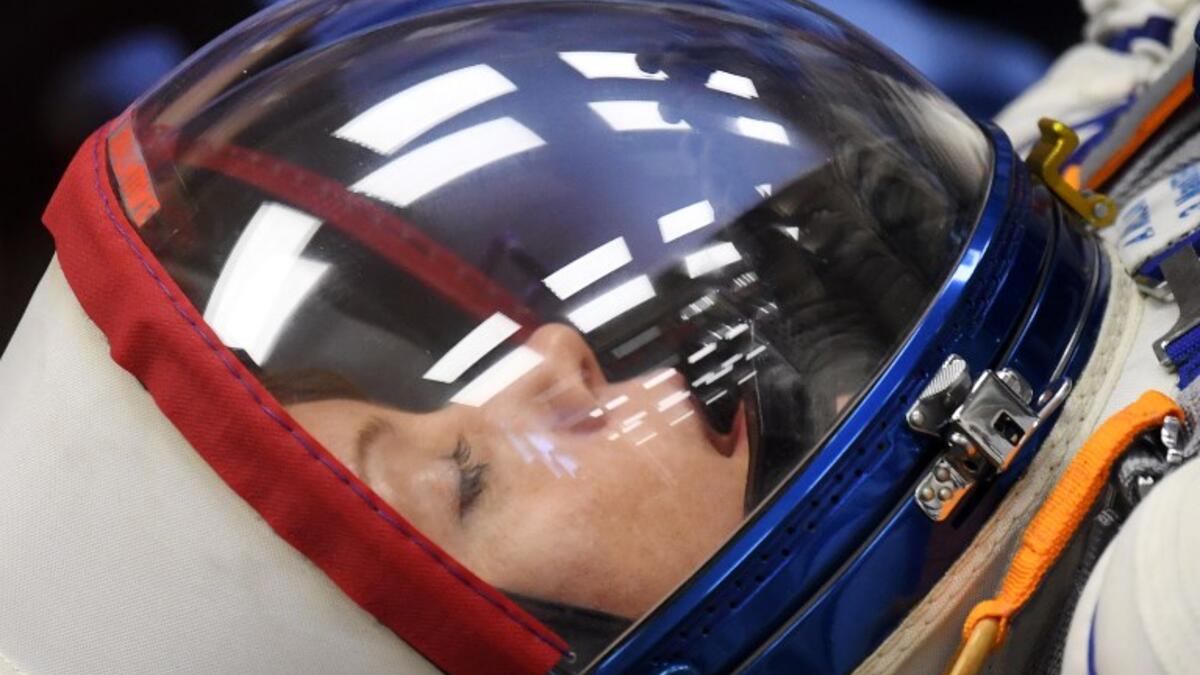 NASA astronaut Anne McClain, a member of the International Space Station (ISS) expedition 58/59, reacts as her space suit is tested prior to the launch onboard the Soyuz MS-11 spacecraft at the Russian-leased Baikonur cosmodrome in Kazakhstan on December 3, 2018. 
Kirill KUDRYAVTSEV / AFP
