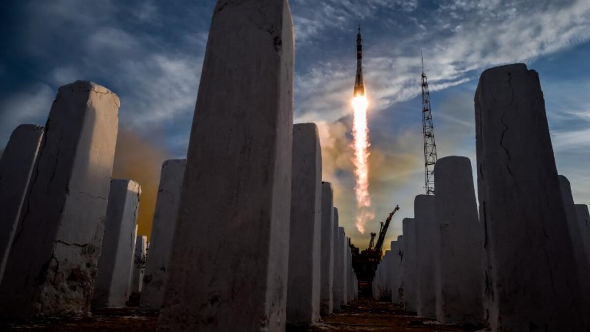 A Soyuz MS-11 rocket carrying Russian, American and Canadian astronauts takes off from the Baikonur Cosmodrome on December 3, 2018 before reached orbit later, the first manned mission since a failed launch in October. 
Kirill KUDRYAVTSEV / AFP