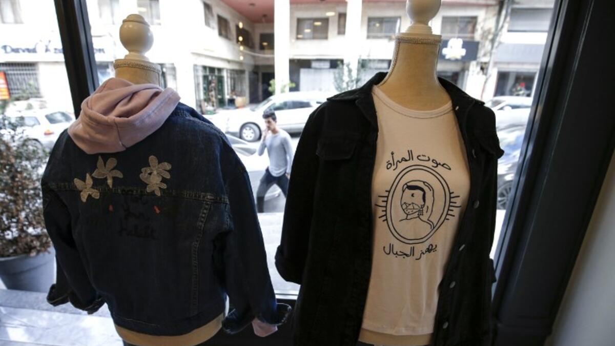 This picture shows clothing from the Palestinian feminist fashion label "BabyFist" on display at a shop in Ramallah in the occupied West Bank. 
ABBAS MOMANI / AFP