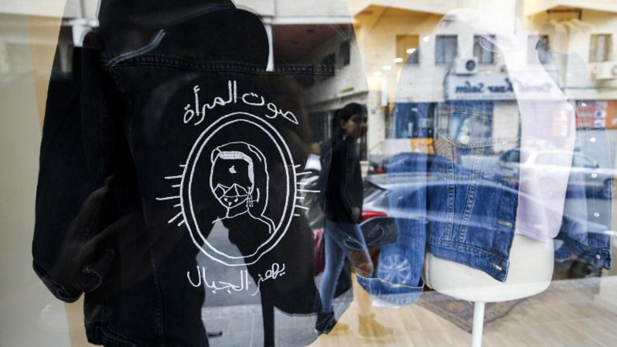 This picture shows clothing from the Palestinian feminist fashion label "BabyFist" on display at a shop in Ramallah in the occupied West Bank. 
ABBAS MOMANI / AFP