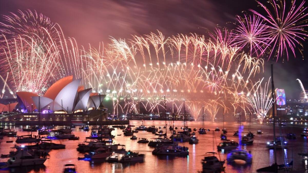 New Year's Eve fireworks erupt over Sydney's iconic Harbour Bridge and Opera House during the fireworks show on January 1, 2019. 
PETER PARKS / AFP