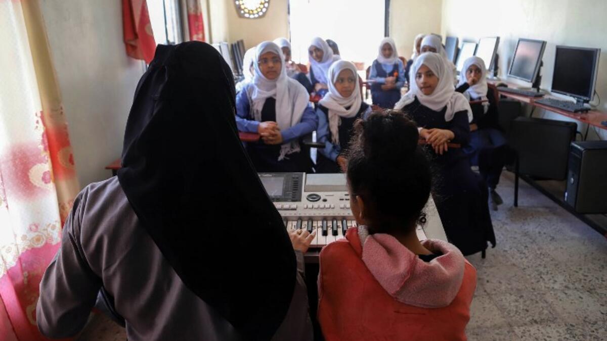 Children attend a music class at the Al-Nawras school in Taez, Yemen's third city, in the country's southwest
AHMAD AL-BASHA / AFP
