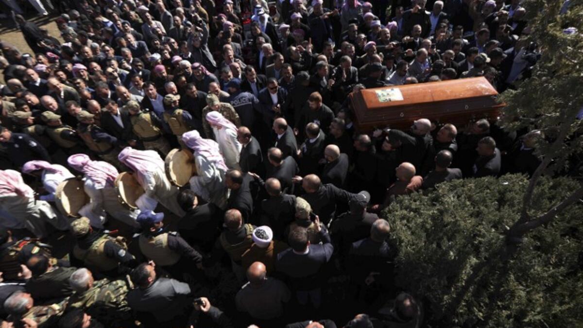 Iraqi Yazidis carry the coffin of the Mir Takhsin-Beg (Tahseen Said Ali), the hereditary leader of the Yazidi community in the world, during his funeral in the town of Sheikhan.
SAFIN HAMED / AFP