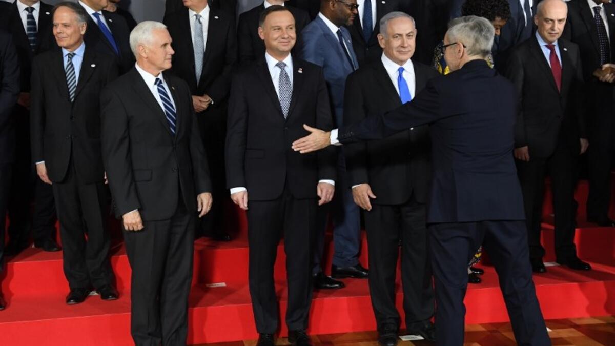 US Vice President Mike Pence, Poland's President Andrzej Duda and Prime minister of Israel Benjamin Netanyahu are seen during preparations for a family photo at the conference on Peace and Security in the Middle east in Warsaw, on February 13, 2019 
Janek SKARZYNSKI / AFP