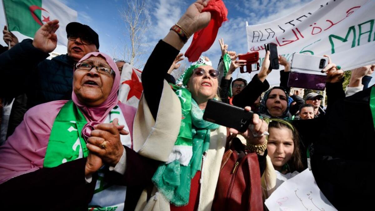Protesters hold Algerian national flags during a sit-in against the Algerian president's bid for a fifth term in office
GERARD JULIEN / AFP