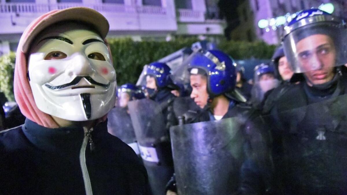 Algerian police stand guard during a demonstration in the capital Algiers against ailing President Abdelaziz Bouteflika's bid for a fifth term
RYAD KRAMDI / AFP