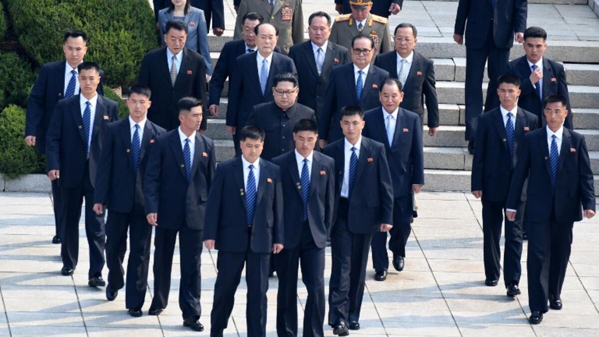 North Korea's leader Kim Jong Un escorted with full body guards to the demarcation line to meet his South Korean counterpart President Moon Jae-in. April 27, 2018, (AFP File Photo)