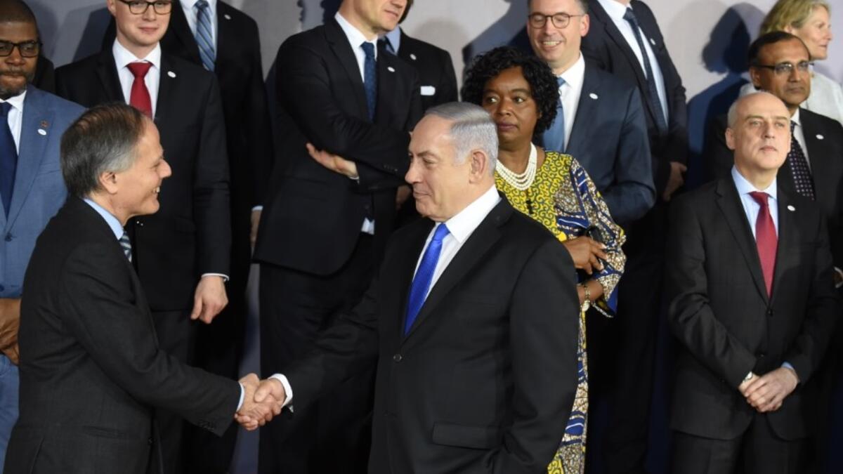 Israeli Prime Minister Benjamin Netanyahu greets participants prior to a family photo during the conference on Peace and Security in the Middle east in Warsaw, on February 13, 2019 
Janek SKARZYNSKI / AFP