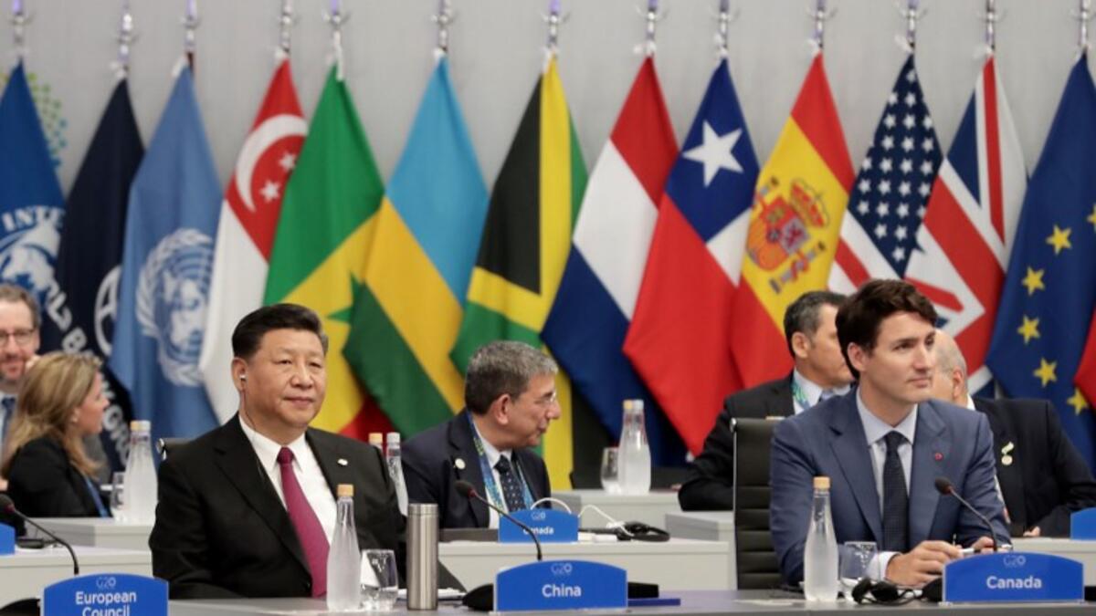 China's President Xi Jinping(R) and Canadian Prime Minister Justin Trudeau attend the G20 Leaders' Summit in Buenos Aires, on November 30, 2018. 
Alejandro PAGNI / AFP