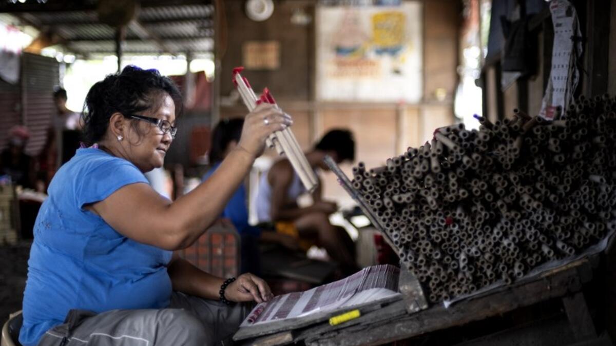 A worker makes fireworks for New Year celebrations in Bocaue, Bulacan, north of Manila on December 26, 2018. 
Noel CELIS / AFP