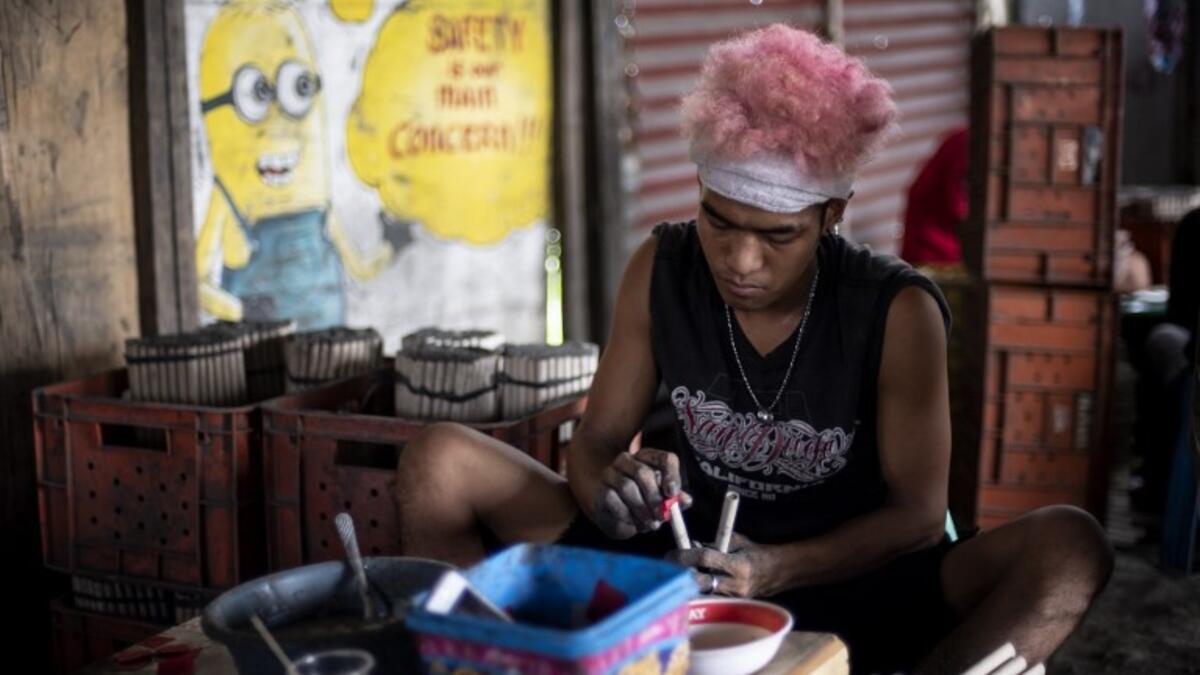 A worker makes fireworks for New Year celebrations in Bocaue, Bulacan, north of Manila on December 26, 2018. 
Noel CELIS / AFP