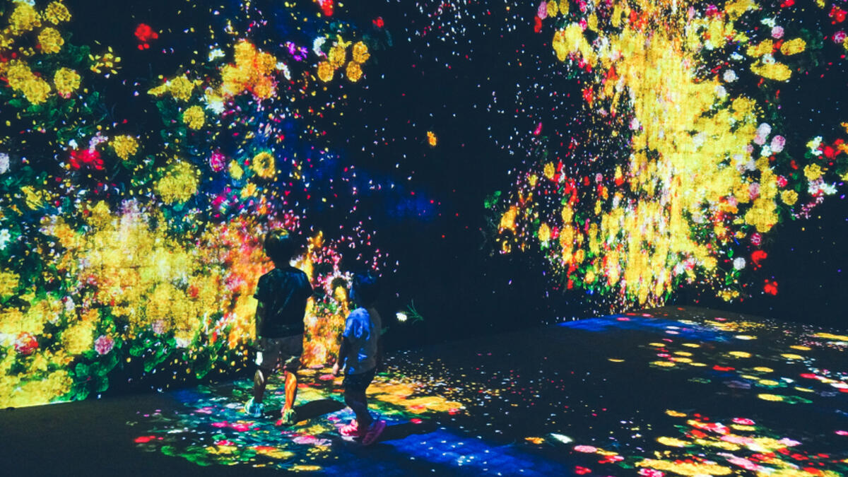 Kids watched on as flowers ‘bloom’ on the walls in a permanent exhibition by teamLab in the Mori Digital Art Museum. in Tokyo, Japan on 14 July 2018. (Shutterstock/File)