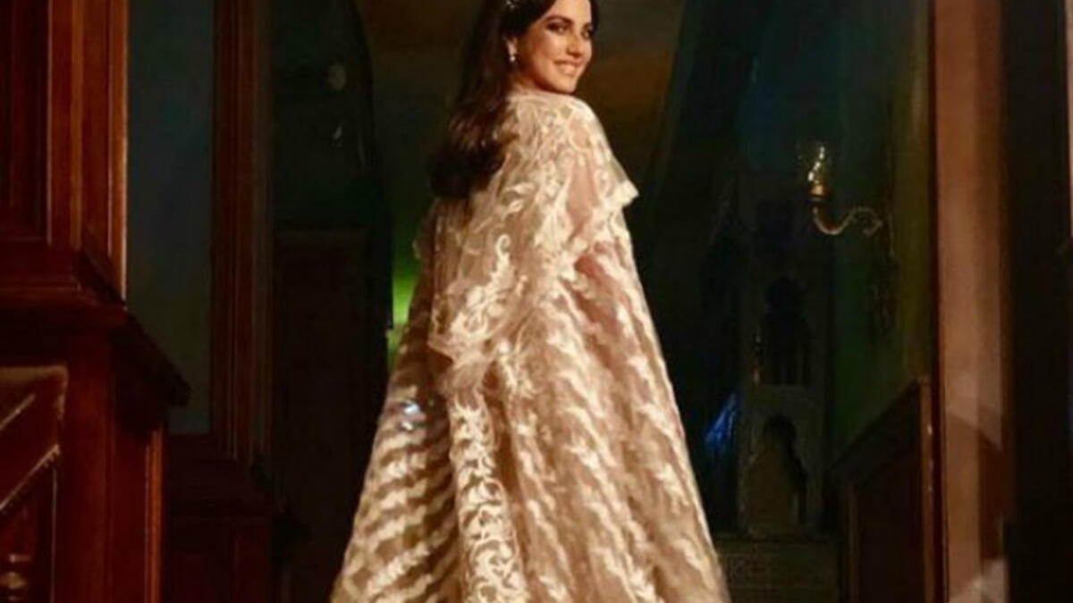 Tunisian beauty Dorra put on a cape dress designed by Egyptian designer Hany Elbehairy in Nassr Al Said Said's Eagle series