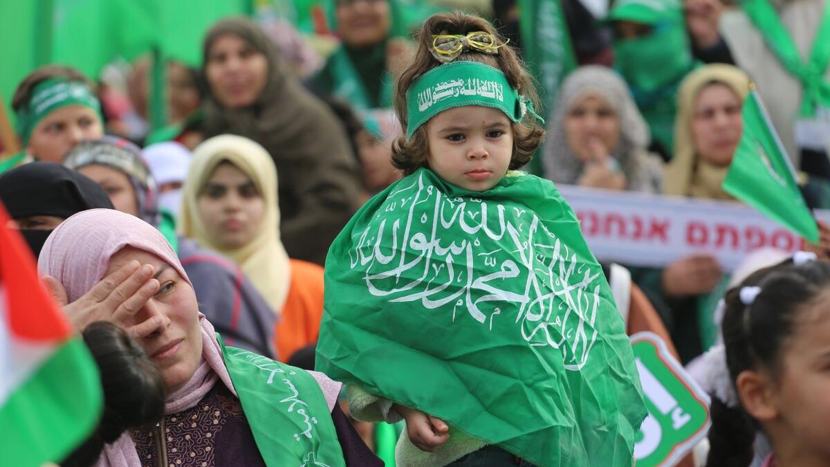 Palestinians attend a rally marking the 31st anniversary of Hamas' founding. (Twitter)