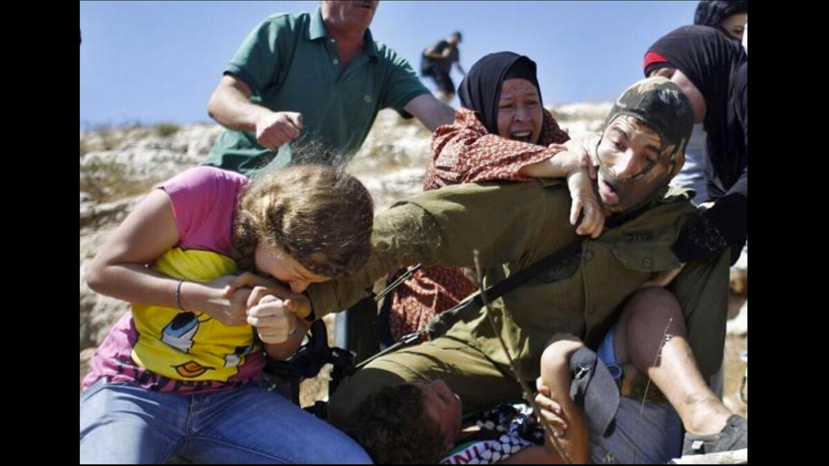 palestinian family attacks masked israeli soldier video