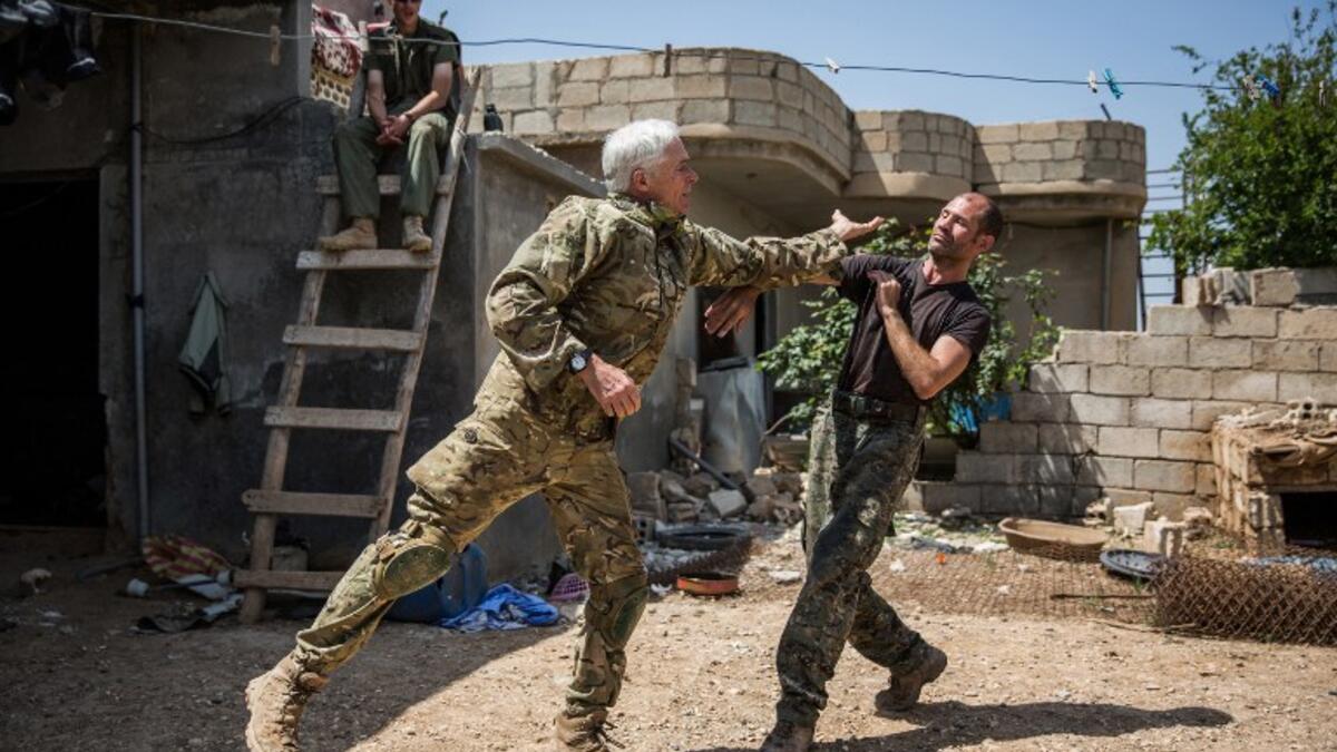 Nicknamed by Kurdish fighters, Canadian "Hewal Zinar,” 67, and Briton “Hewal Cudi,”40, train on the outskirts of the Syrian border town of Tal Tamr on April 19, 2015. Fighters come from a diverse range of military backgrounds and have poured into Syria to fight alongside Kurdish People's Protection Units (YPG.)