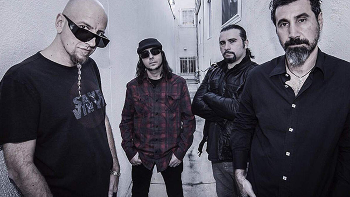 a
System of a Down also features songwriter-drummer John Dolmayan, also born in Beirut in 1973. During the Lebanese Civil War, a stray bullet hit his boyhood (and thankfully unoccupied) Beirut bed, prompting his family to emigrate and eventually landing in California, where Dolmayan would meet future bandmate Tankian.