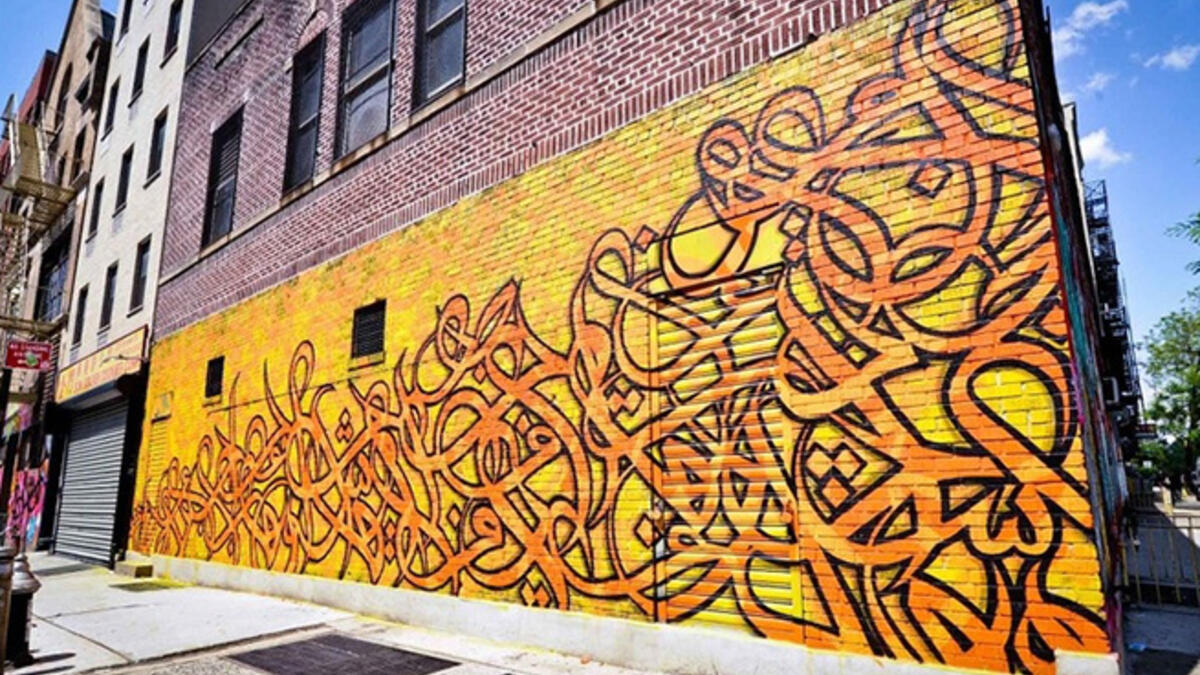 eL Seed graffiti wall Arab artist New York