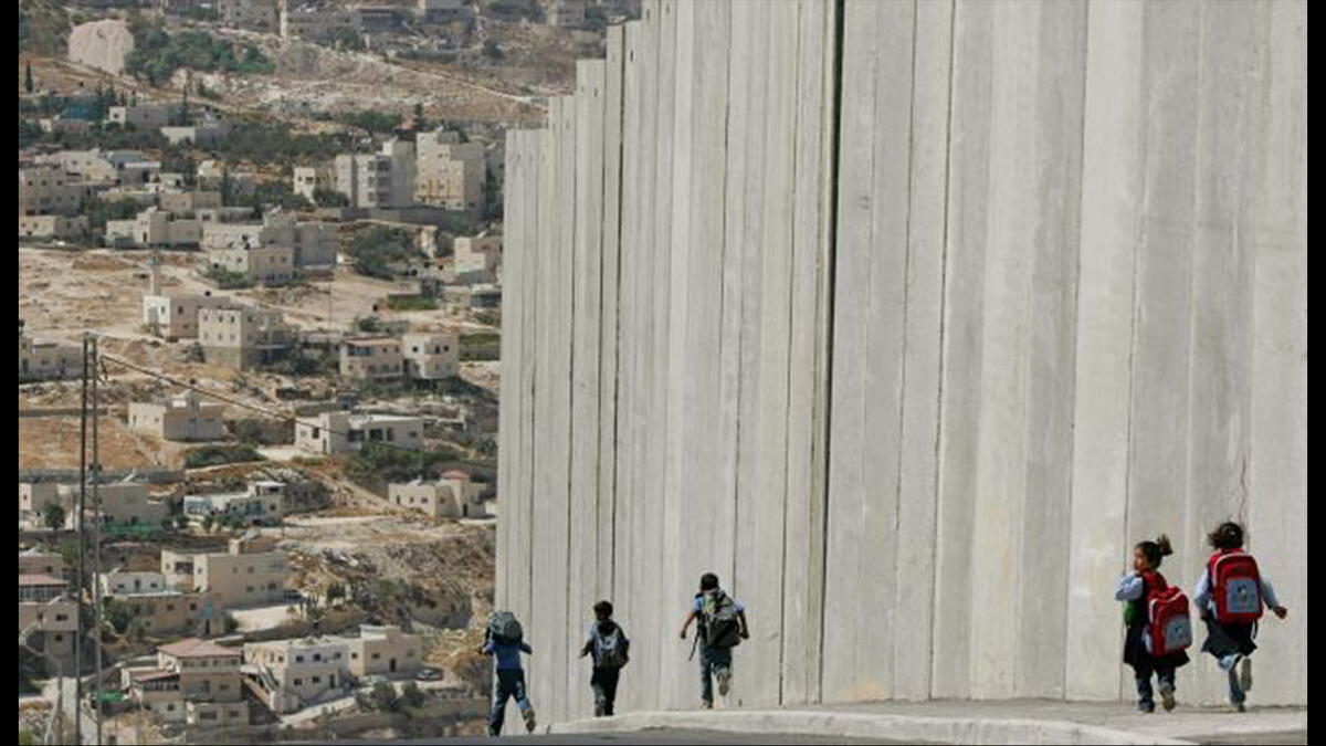 children against the Israel barrier