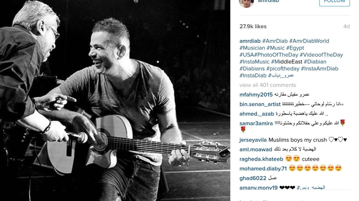 Amr Diab playing the guitar