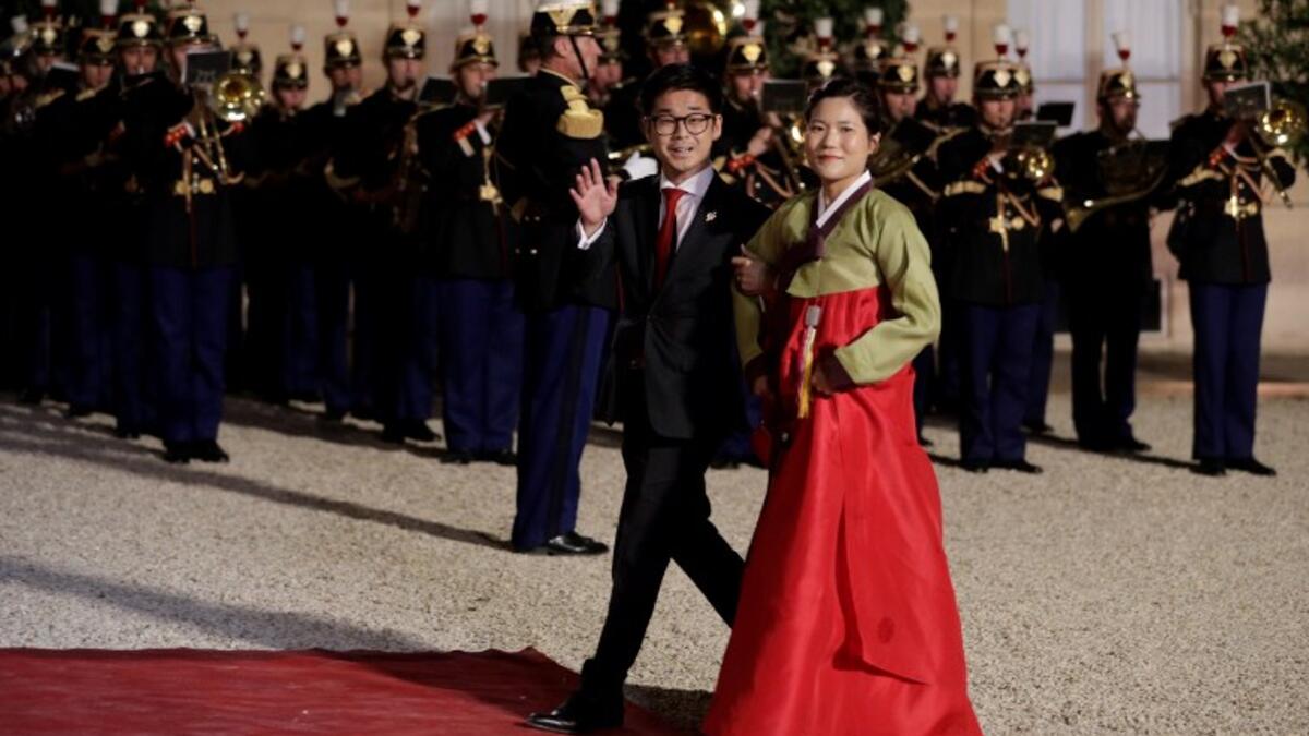South Korean officials arrive for a state dinner with the South Korean President at the Elysee Presidential Palace in Paris on October 15, 2018. (Geoffroy VAN DER HASSELT / AFP)