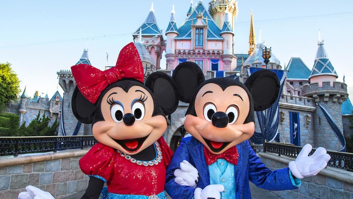 Mickey Mouse and Minnie Mouse look dazzling in their sparkling, new costumes, created especially for the Diamond Celebration at the Disneyland Resort. (disneyexaminer.com)
