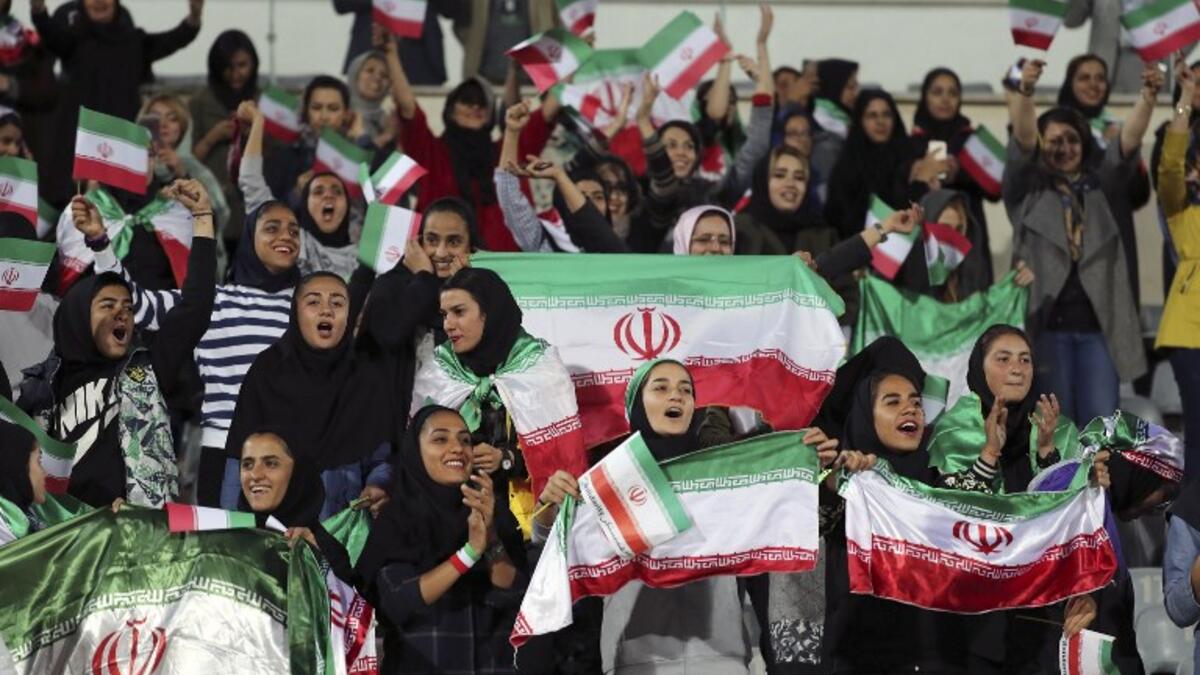 Iranian women cheer during the friendly football match between Iran and Bolivia at the Azadi Stadium in Tehran on October 16, 2018. (STR / AFP)