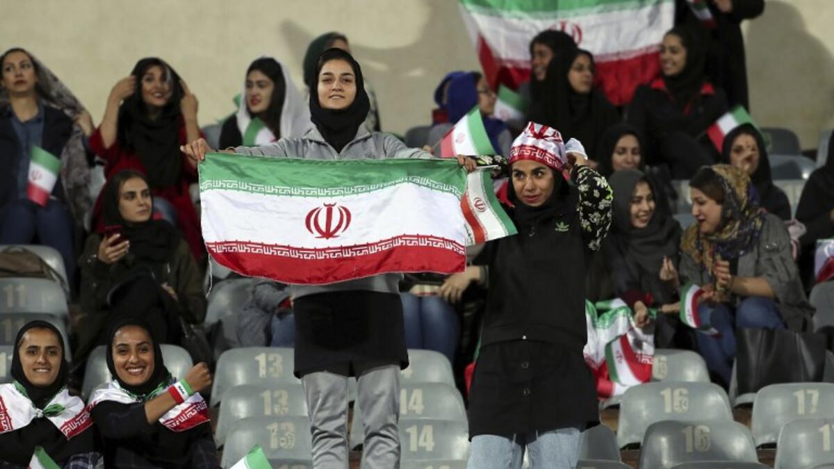 Iranian women cheer during the friendly football match between Iran and Bolivia at the Azadi Stadium in Tehran on October 16, 2018. (STR / AFP)