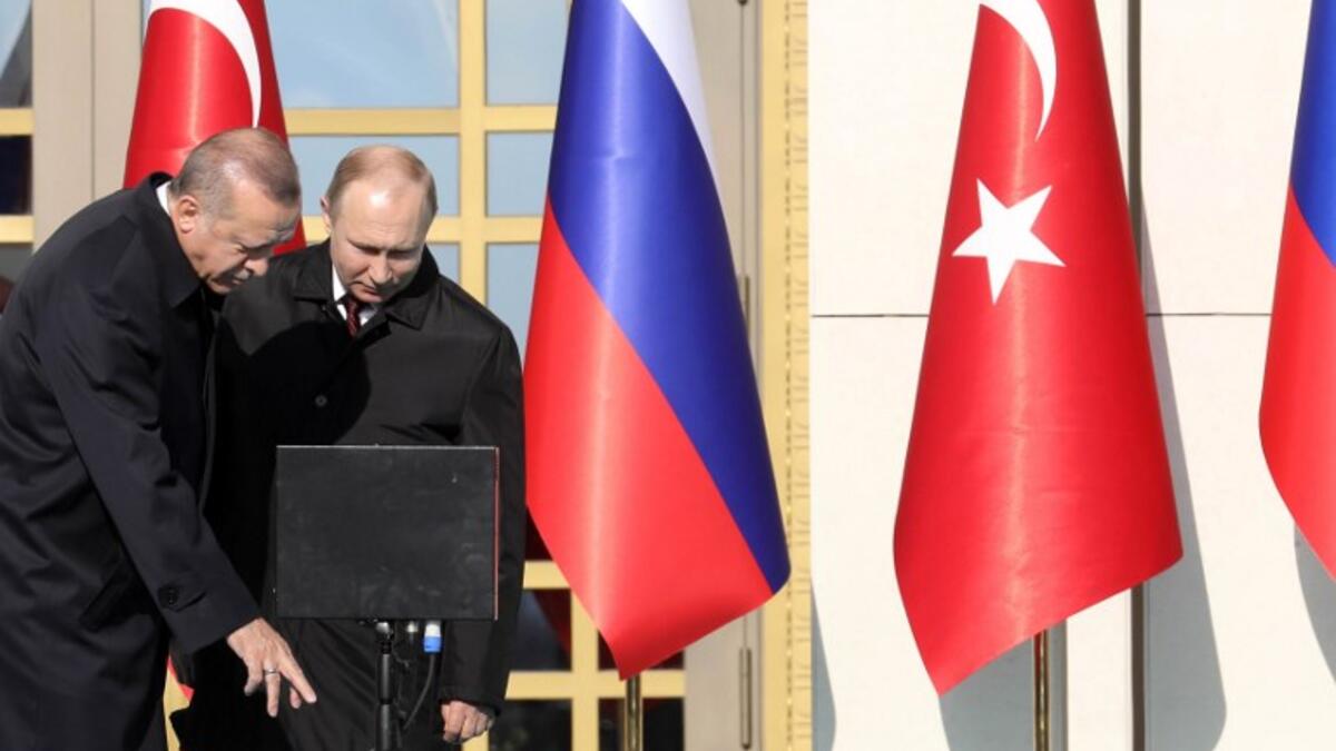 Turkish President Erdogan (L) and Putin attend a ground-breaking ceremony of Turkey's first nuclear power station at the Presidential Palace in Ankara on April 3, 2018.  Putin arrived for a Turkey visit also to coordinate policy on Syria. (AFP File Photo)