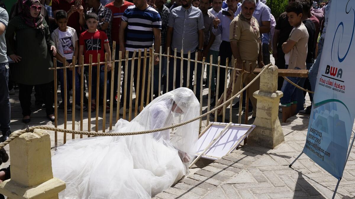 This photo shows that woman subjected to rape in Iraq are forced to obey Article 398 which allows rapist men to marry their victims, which limits women's right. 
Baghdad's Woman Association