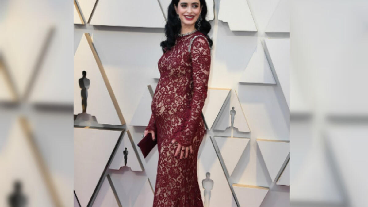 Krysten Ritter chose a burgundy gown by Reem Acra