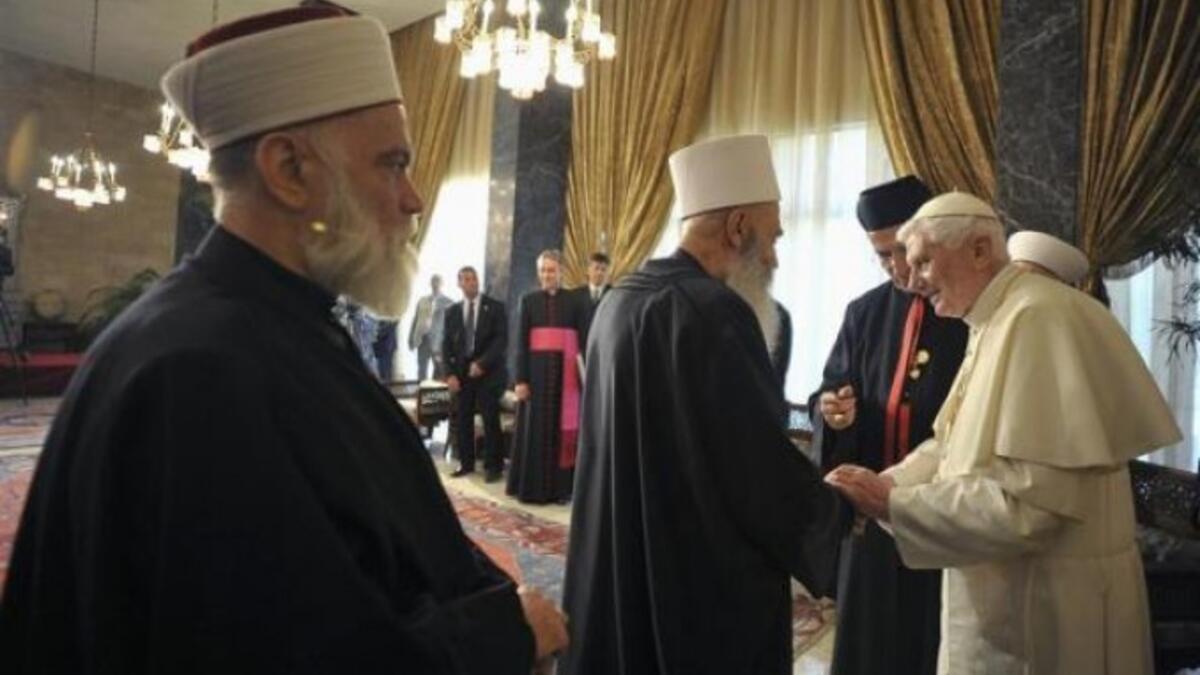 Sunnis accuse Alawis of watering down Islamic doctrine with dollops of Neoplatonism, Gnosticism, and Christianity (adopting Christian names, celebrating Christmas, and worshiping at Mass). It’s a close cousin to Druze, with many tenets viewed as blasphemous.(Image: Beirut 2012 meeting of Pope Benedict with Alawi and Sunni religious leaders.)